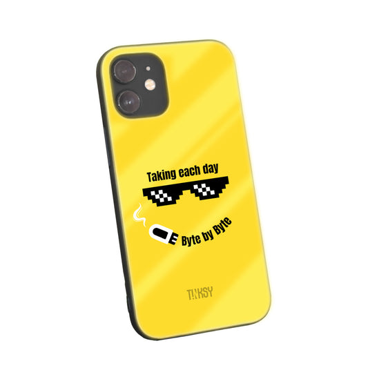 Bright yellow phone case with a playful pixelated sunglasses design