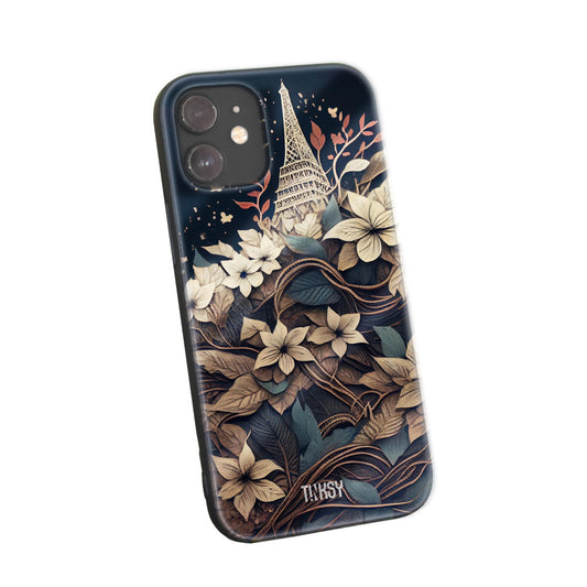 Phone case with an illustration of the Eiffel Tower surrounded by elegant floral designs on a dark background